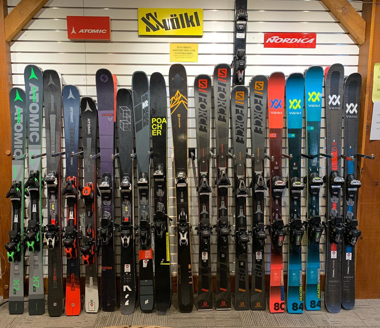 Photo of ski assortment as an example of the types of skis available to demo at Camelback Resort. Brands include Atomic, K2, Salomon and Volkl